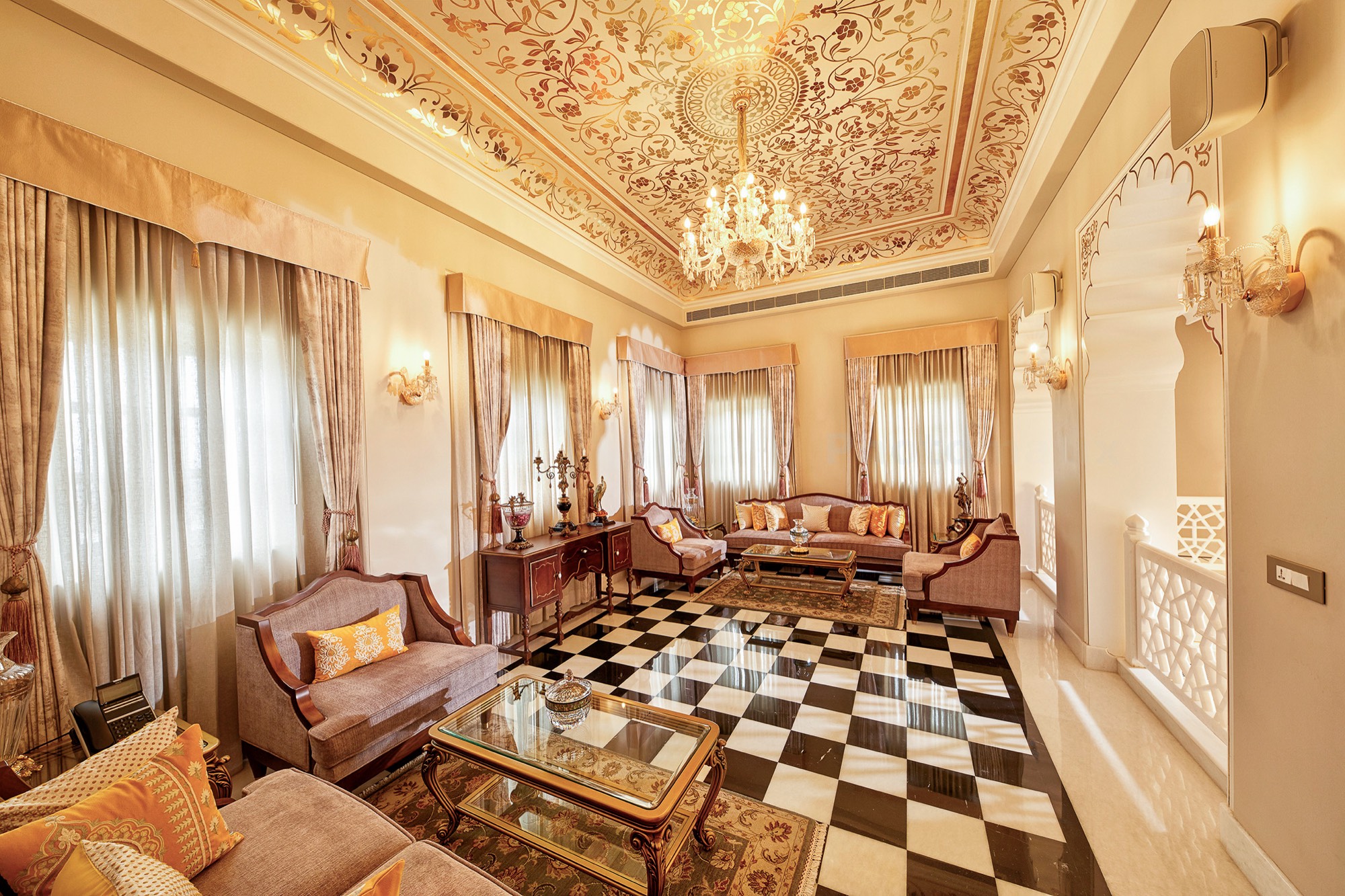 Royal suite living room with painted ceiling and checkered floor